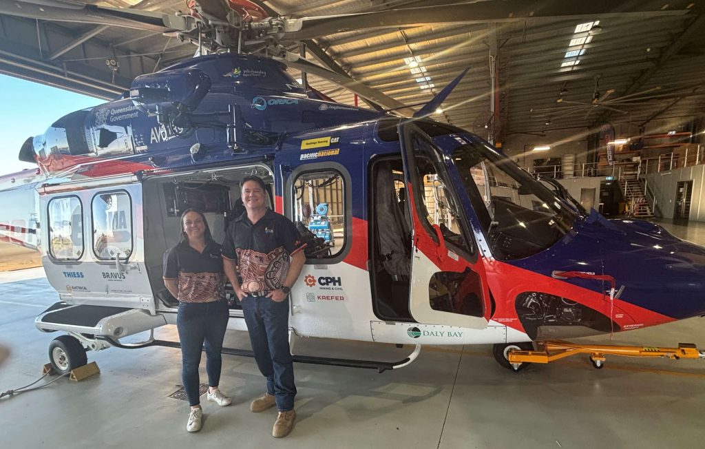 Government Relations and Social Performance Manager Jess Chad and Head of Renewables and Firming Operations Michael Johnson at the BMA CQ Rescue Hangar in Mackay.