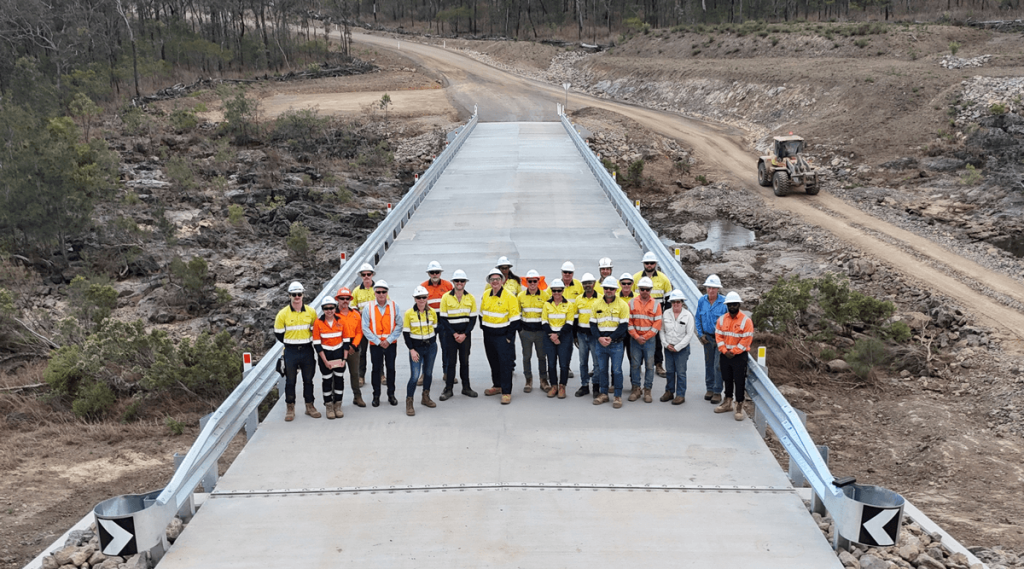 Construction team on newly built bridge